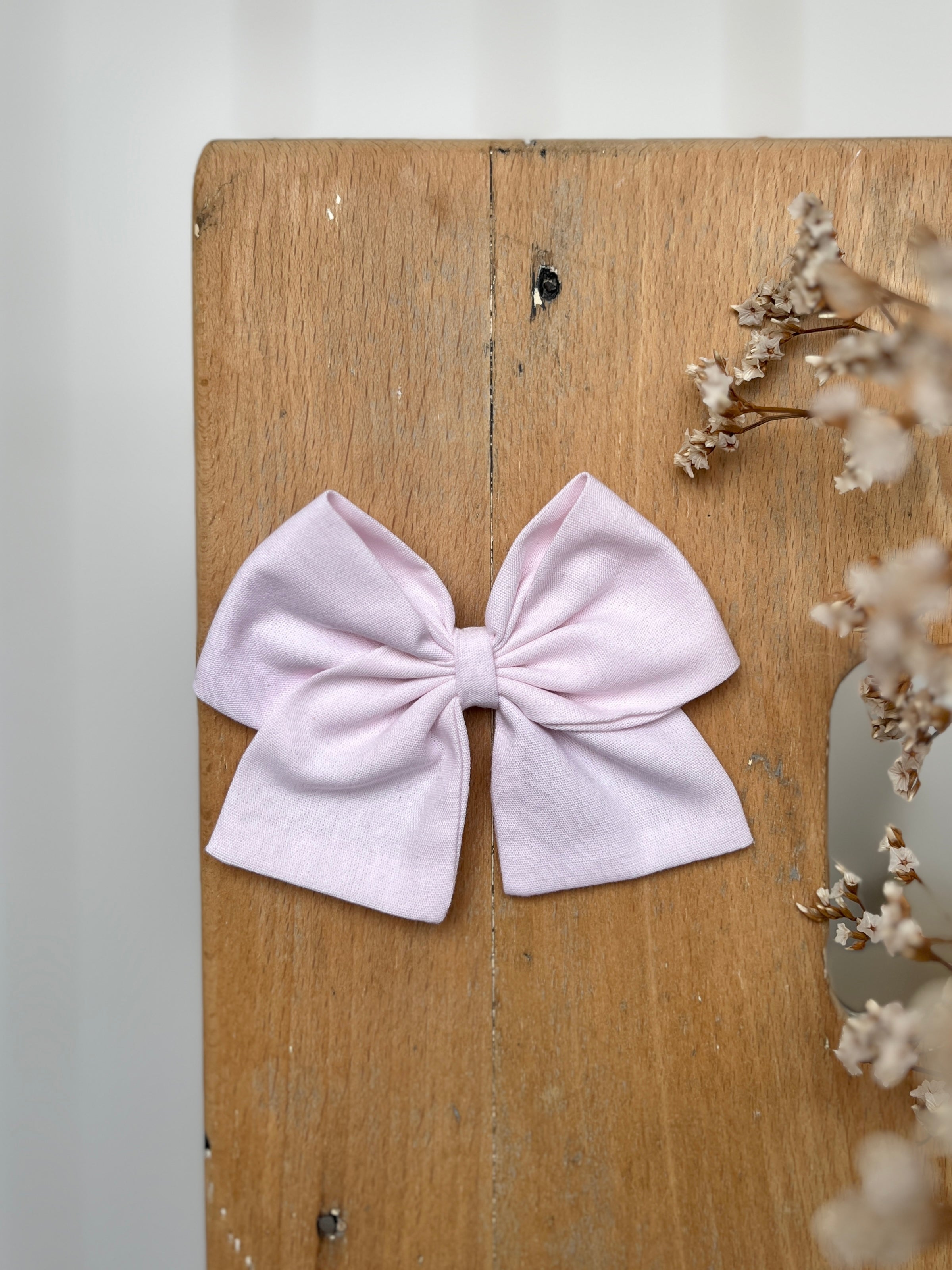 La barrette à gros noeud Brunette unie rose pâle