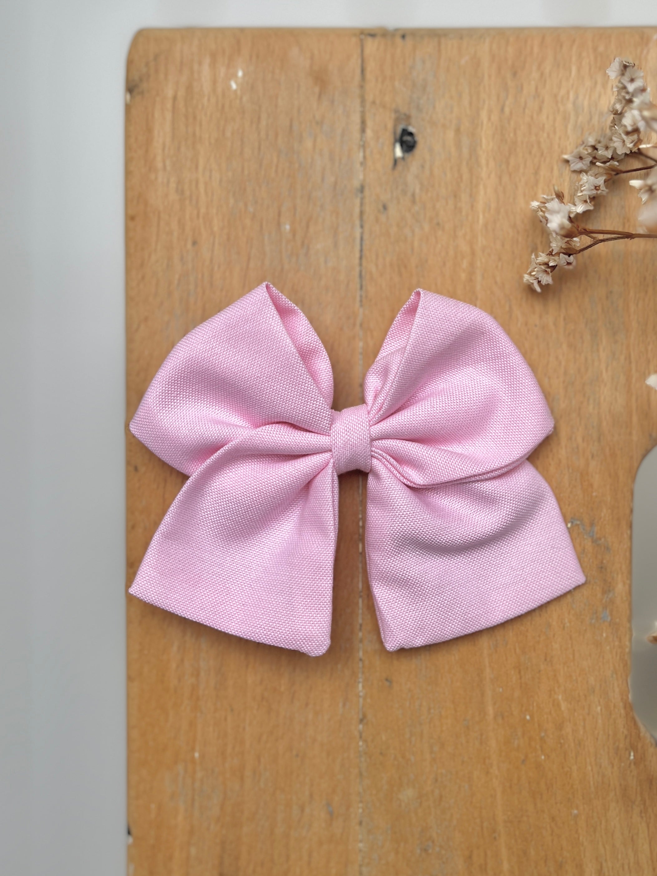 La barrette à gros noeud Brunette unie rose