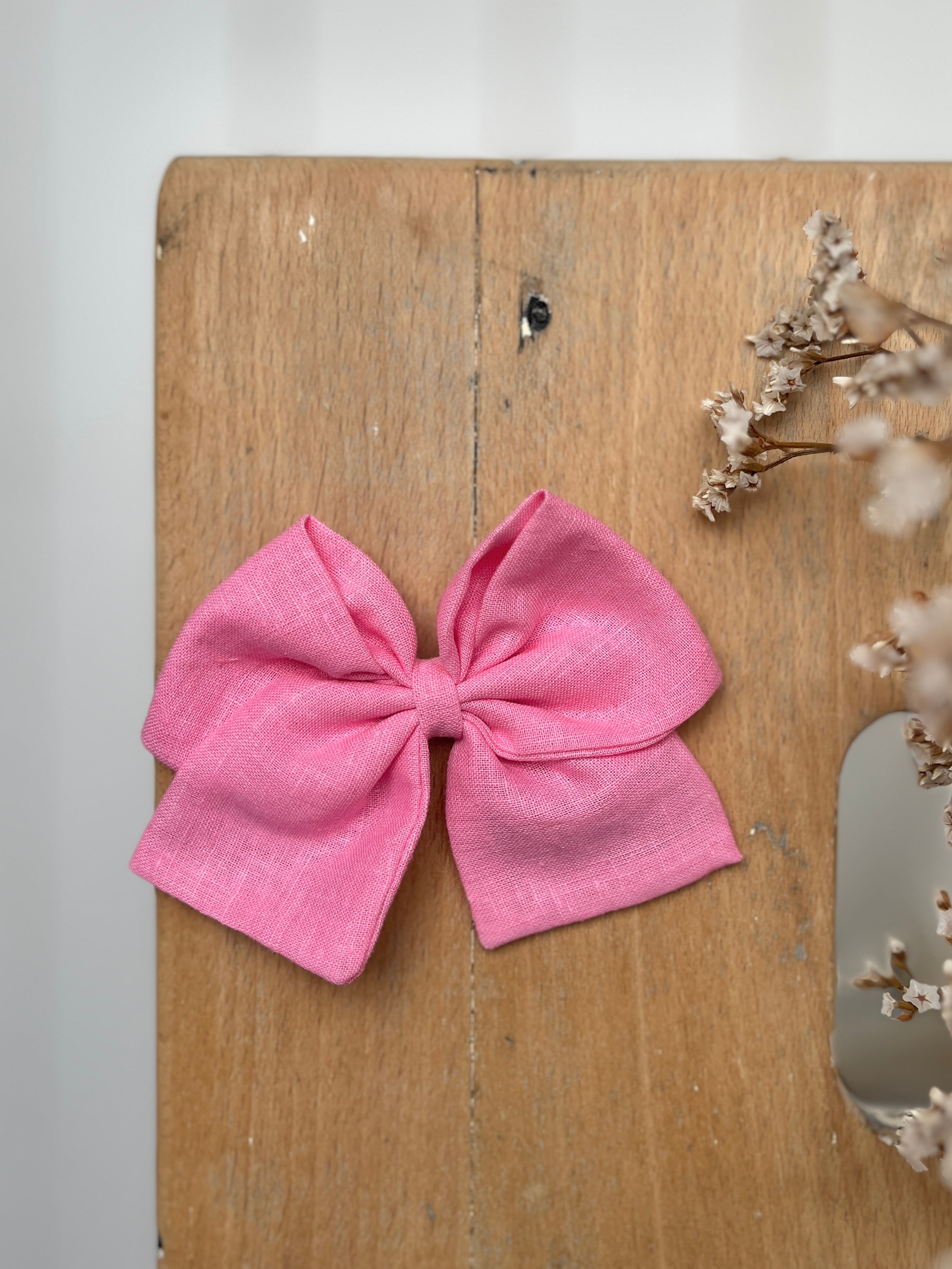 La barrette à gros noeud Brunette unie rose bonbon