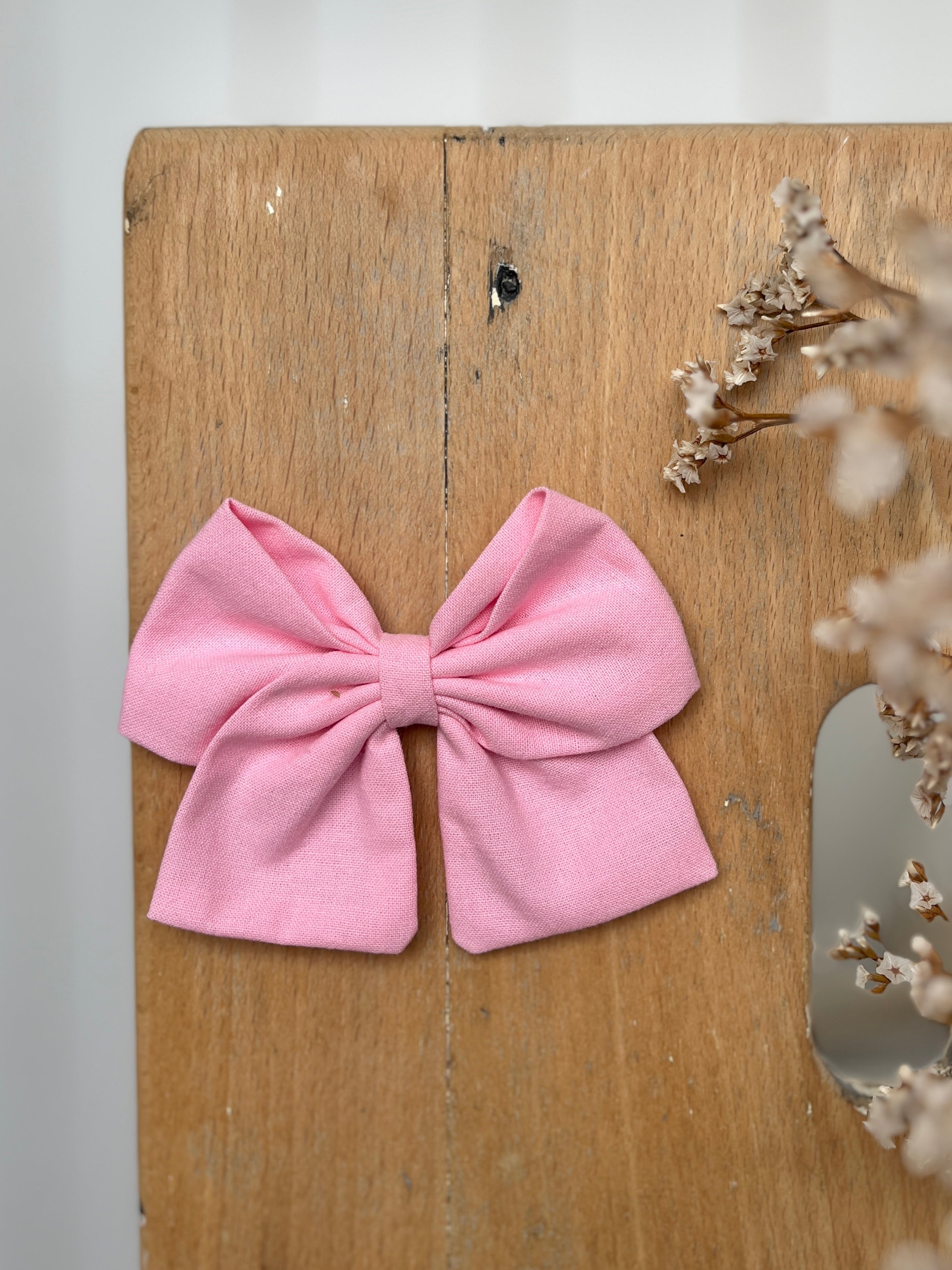 La barrette à gros noeud Brunette unie rose moyen