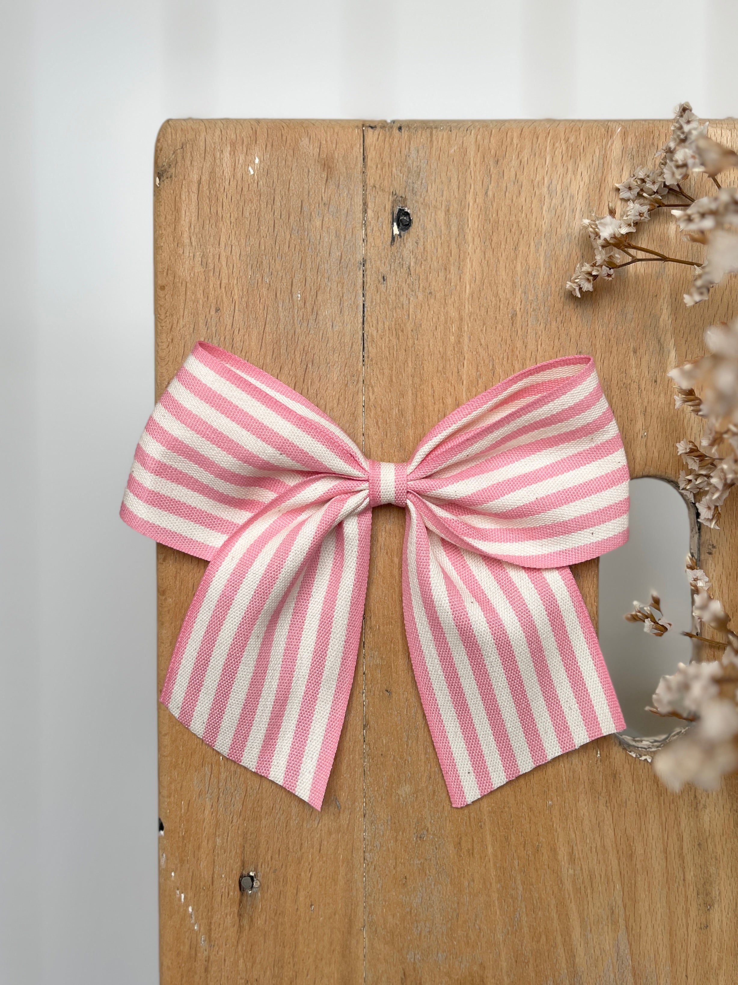 La barrette à gros noeud Brunette rayures transat rose (taille XL)