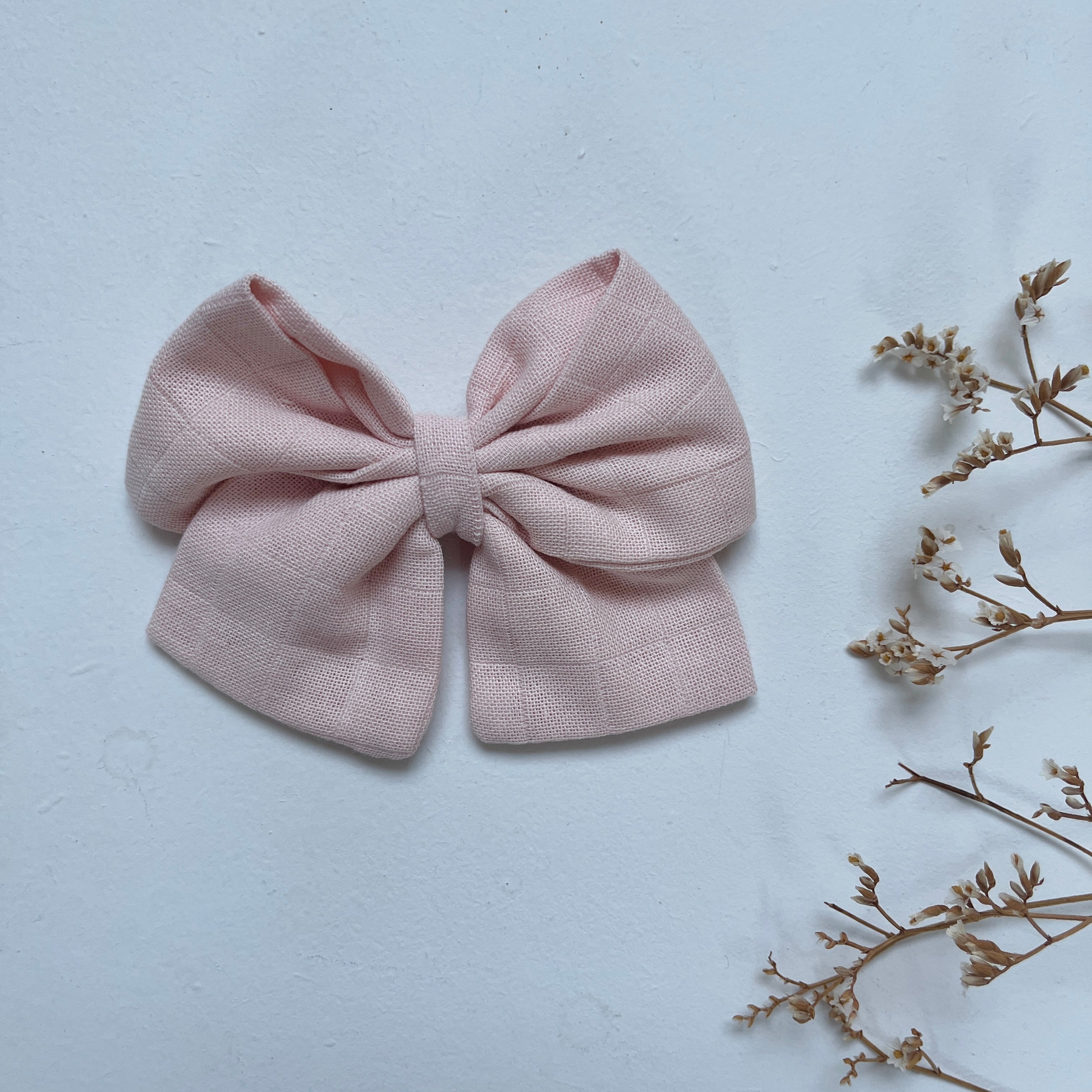 La barrette à gros noeud Brunette unie lange rose poudré