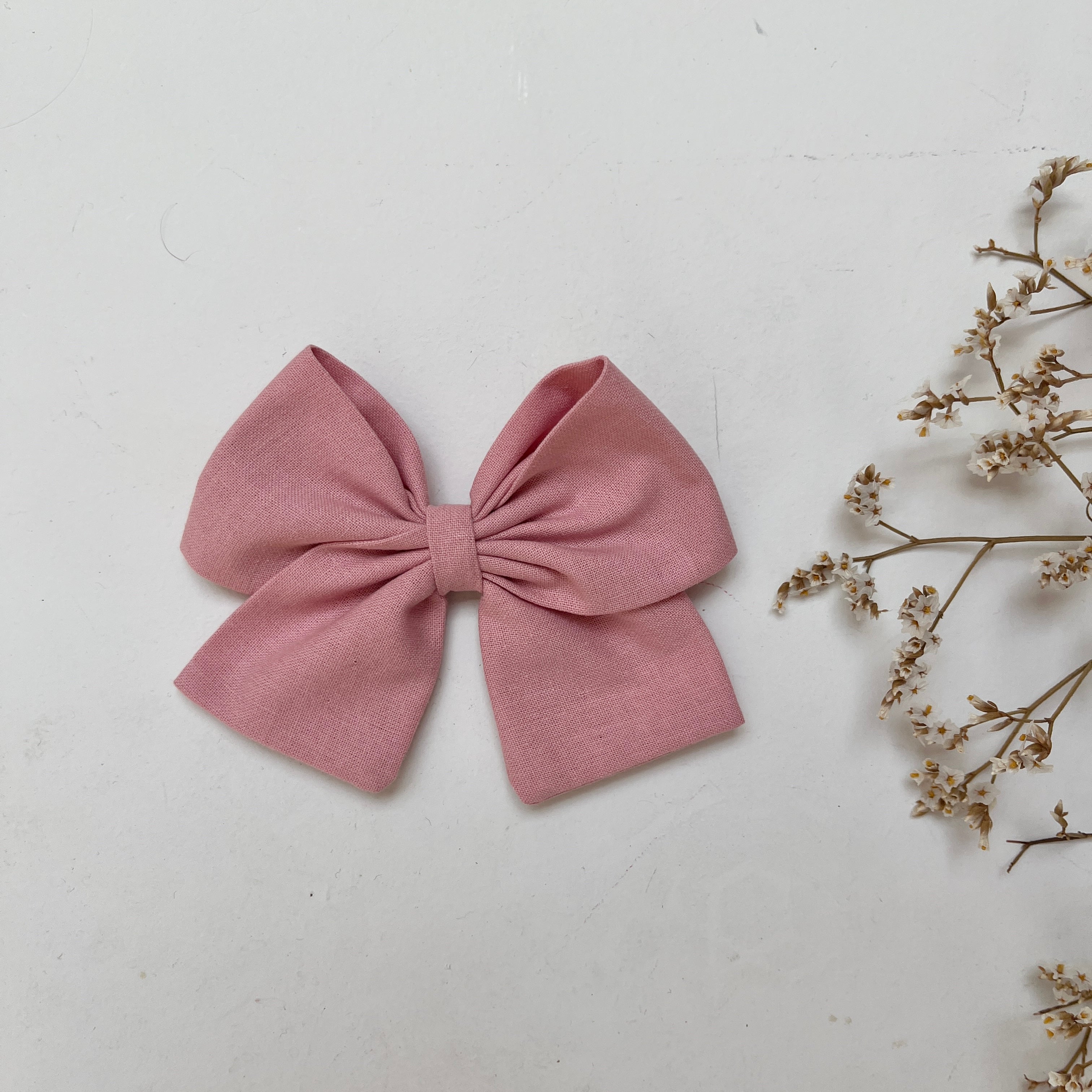La barrette à gros noeud Brunette unie vieux rose