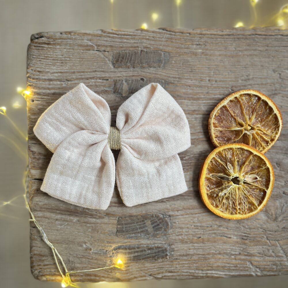 Noël: La barrette à gros nœud Brunette rose poudré doré